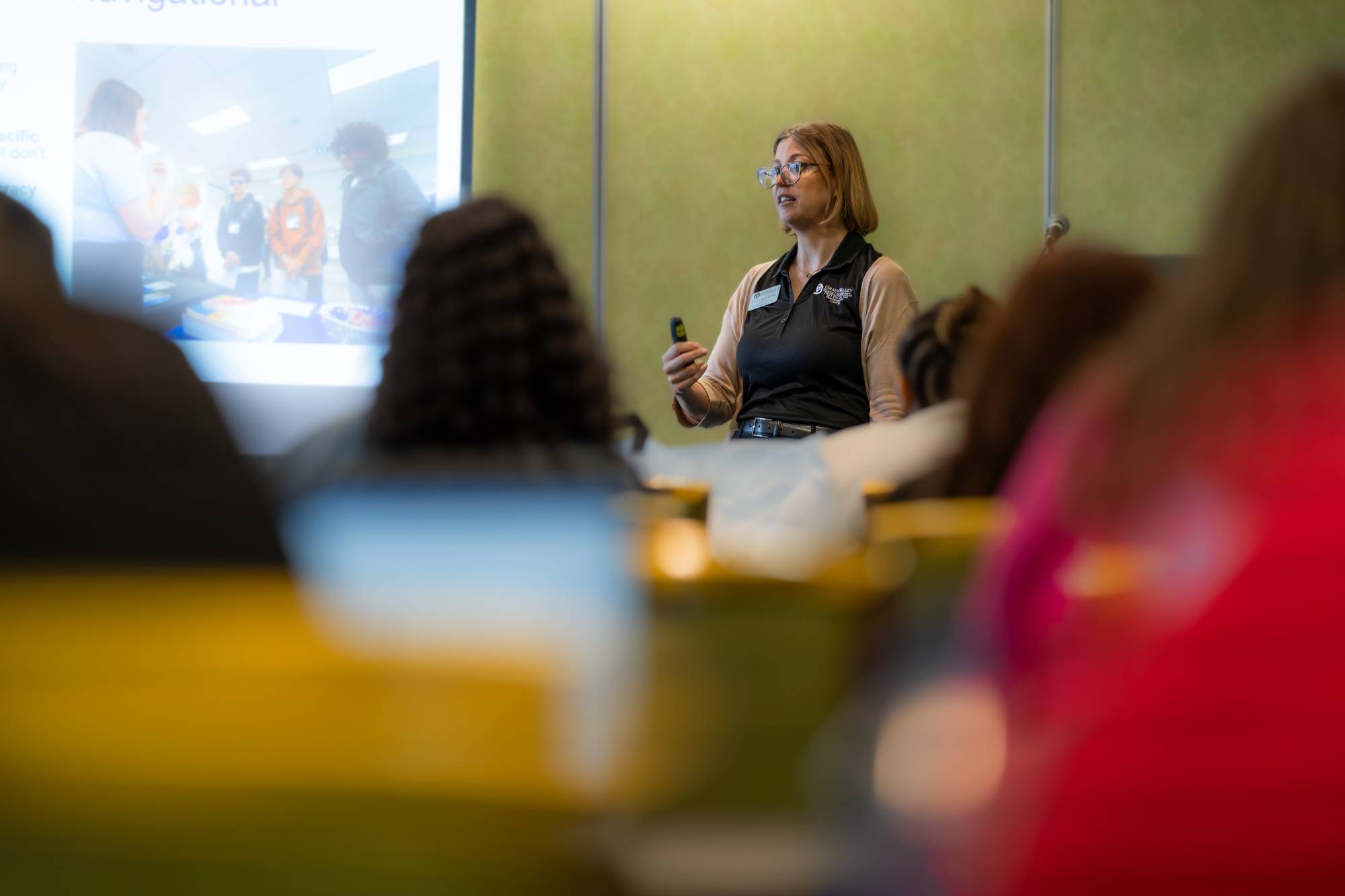 Jessica Saint Amour speaking to crowd of priority 4 trainees